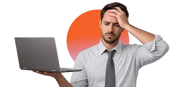 Man looking worried at a laptop