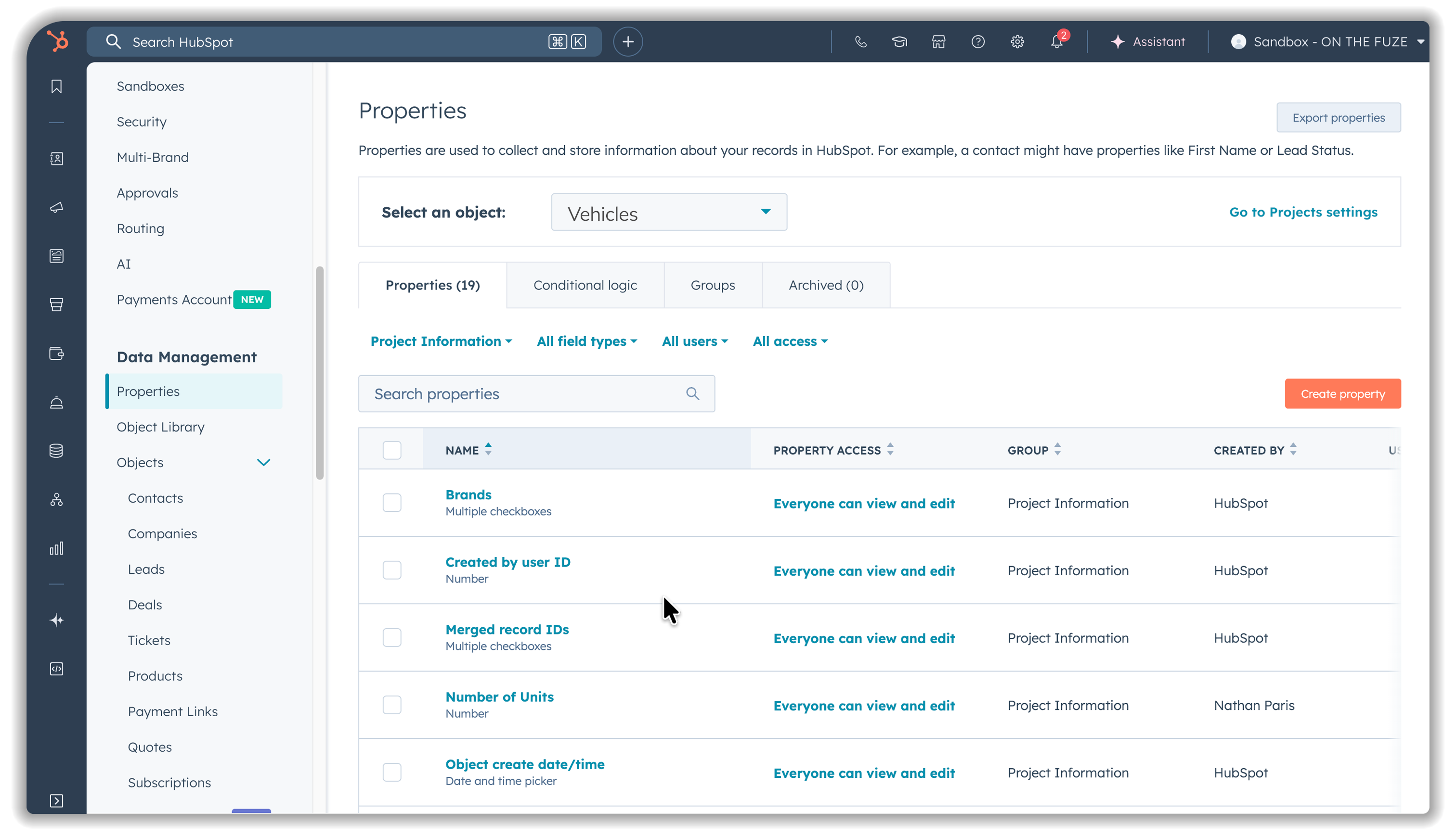 HubSpot Custom Object properties management screen for Vehicles object showing property list with fields including Brands, Created by user ID, Merged record IDs, Number of Units, and Object create date/time with access permissions and groups