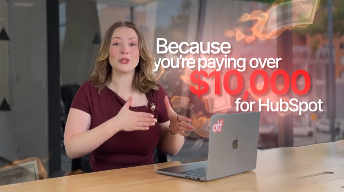Gabrielle Paris, VP of sales at On The Fuze, presenting HubSpot Support at a desk with a laptop, surrounded by flying dollar bills. Large text reads, “you’re paying over $10,000 for HubSpot.”