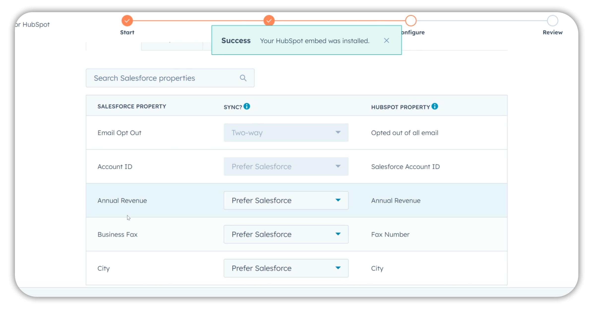 Integrating HubSpot with Salesforce: field mapping interface showing sync rules between Salesforce properties and HubSpot properties with two-way and prefer Salesforce options