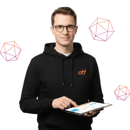 Team member using a tablet with geometric graphics behind